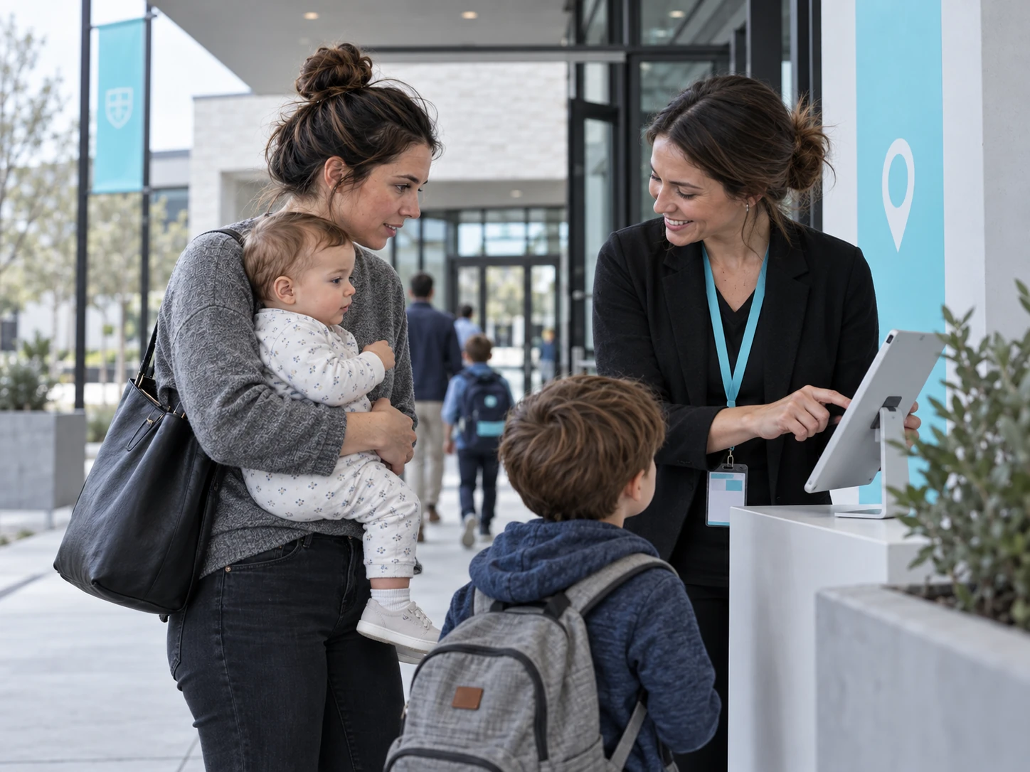 Illustrative family being welcomed at a school reception desk.