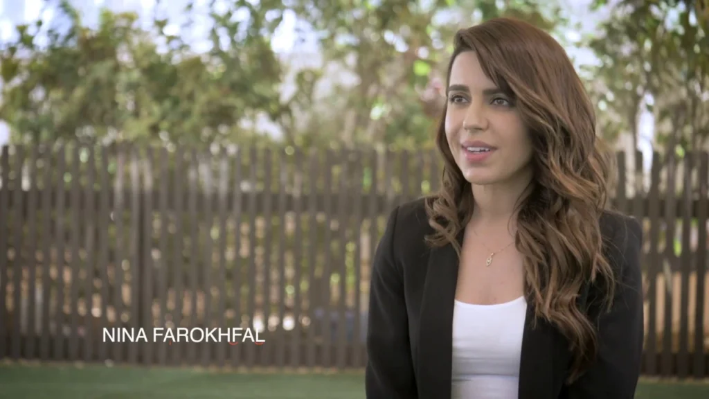 Nina Farokhfal speaking outdoors in the Art Village Nursery introduction film.